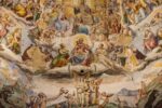 Photo of a fresco in Santa Maria del Fiore, Florence, Renaissance-style art depicting heavenly images above earthly scenes. Many people and angelic figures are portrayed, in a realistic style typical of that period.