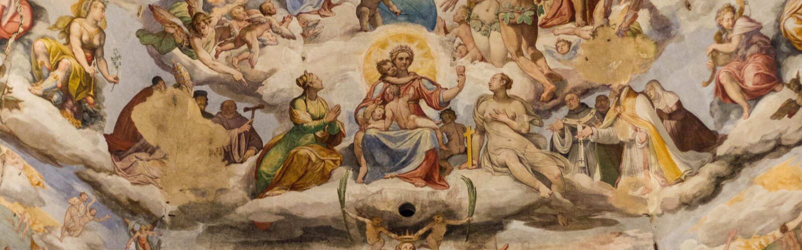 Photo of a fresco in Santa Maria del Fiore, Florence, Renaissance-style art depicting heavenly images above earthly scenes. Many people and angelic figures are portrayed, in a realistic style typical of that period.