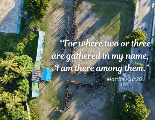 Bulletin 2026-09-06 An aerial image showing people gathering to form the shape of a cross. Buildings and trees are also visible. "For where two or three are gathered in my name, I am there among them. Matthew 18:20"