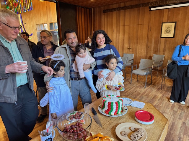 A family at coffee hour following the Christmas Pageant.